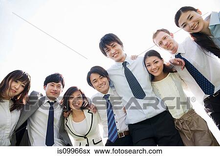 Businesspeople with arms around each other View Large Photo Image Stock Photo - Businesspeople with arms around each other. Fotosearch