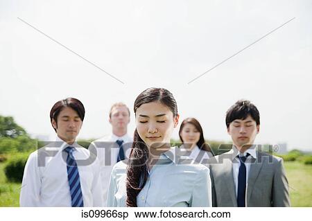 Stock Photography - Businesspeople with eyes closed. Fotosearch