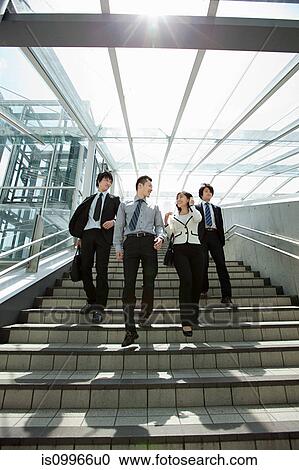 Four businesspeople on steps View Large Photo Image Stock Image - Four businesspeople on steps. Fotosearch