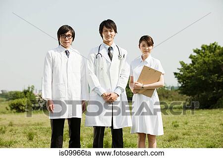 Stock Image - Male doctors and female nurse, portrait. Fotosearch