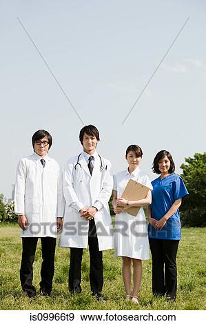 Male doctors and female nurses in field View Large Photo Image Stock Photo - Male doctors and female nurses in field. Fotosearch