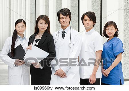 Stock Photo - Portrait of doctors and businesswoman. Fotosearch