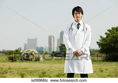 Portrait of young male doctor View Large Photo Image Stock Image - Portrait of young male doctor. Fotosearch