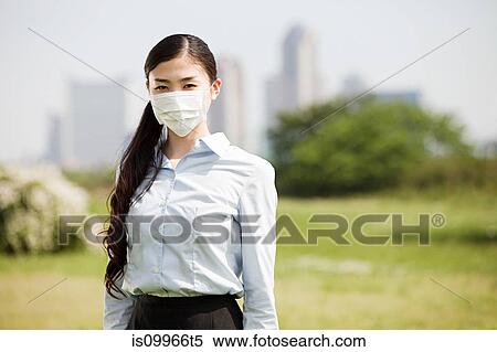 Young businesswoman wearing pollution mask View Large Photo Image Stock Photography - Young businesswoman wearing pollution mask. Fotosearch