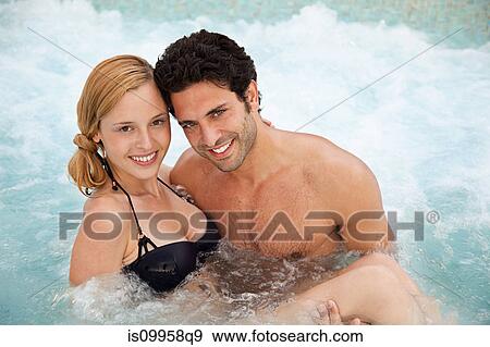 Young couple in hot tub, portrait View Large Photo Image Stock Photo - Young couple in hot tub, portrait. Fotosearch