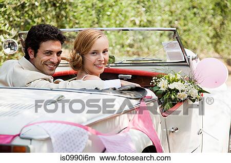 Newlyweds in classic car View Large Photo Image Picture - Newlyweds in classic car. Fotosearch