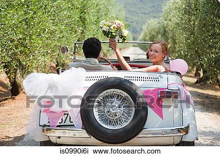 Newlyweds in classic car View Large Photo Image Stock Image - Newlyweds in classic car. Fotosearch