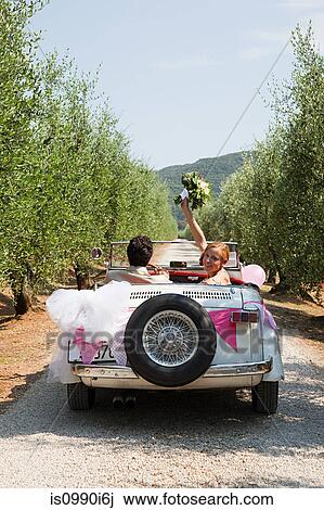 Newlyweds in classic car View Large Photo Image Stock Image - Newlyweds in classic car. Fotosearch