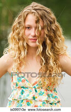 Portrait of a teenage girl with a glazed expression View Large Photo Image Stock Image - Portrait of a teenage girl with a glazed expression. Fotosearch