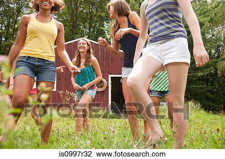 Teenage girls walking and having fun together in countryside View Large Photo Image Stock Image - Teenage girls walking and having fun together in countryside. Fotosearch