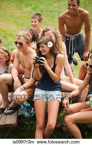 Teenagers hanging out together in the countryside View Large Photo Image Picture - Teenagers hanging out together in the countryside. Fotosearch