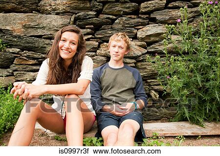 Teenagers resting together in the countryside View Large Photo Image Stock Image - Teenagers resting together in the countryside. Fotosearch