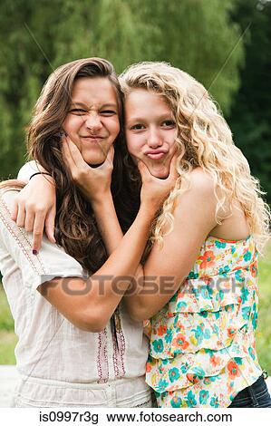 Two teenage girls fooling around and making faces View Large Photo Image Stock Image - Two teenage girls fooling around and making faces. Fotosearch