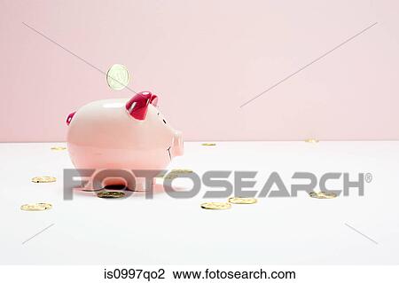 Pink piggy bank and falling coins, studio shot View Large Photo Image Stock Image - Pink piggy bank and falling coins, studio shot. Fotosearch