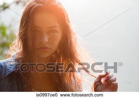Portrait of young Hispanic woman in forest View Large Photo Image Stock Image - Portrait of young Hispanic woman in forest. Fotosearch