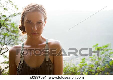 Portrait of young woman in forest View Large Photo Image Stock Image - Portrait of young woman in forest. Fotosearch