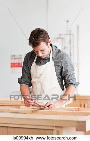 Carpenter using mitre in workshop View Large Photo Image Stock Image - Carpenter using mitre in workshop. Fotosearch