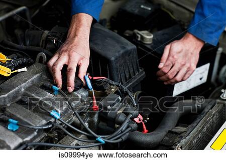Mechanic fixing car engine View Large Photo Image Stock Image - Mechanic fixing car engine. Fotosearch