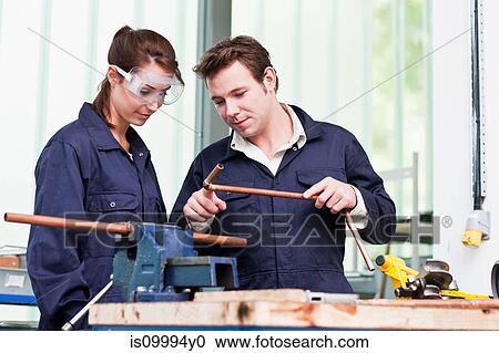 Professional plumber with apprentice in class View Large Photo Image Stock Image - Professional plumber with apprentice in class. Fotosearch
