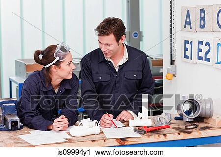 Professional plumber with apprentice in class View Large Photo Image Stock Image - Professional plumber with apprentice in class. Fotosearch