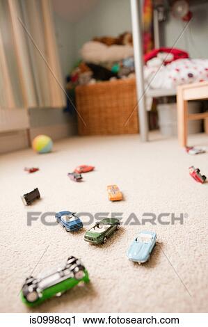 Toy cars scattered across a child's bedroom View Large Photo Image Stock Image - Toy cars scattered across a child's bedroom. Fotosearch
