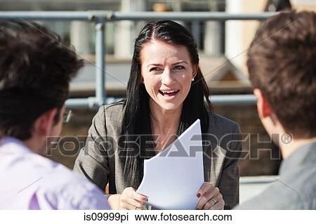 Three people discussing business View Large Photo Image Stock Image - Three people discussing business. Fotosearch