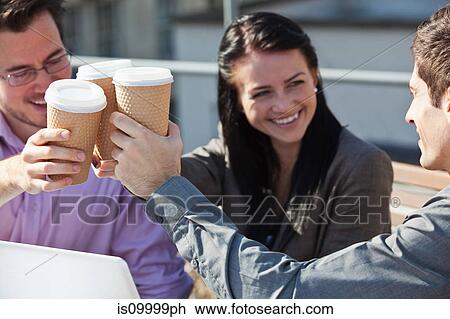 Three people making a toast with cups of coffee View Large Photo Image Stock Image - Three people making a toast with cups of coffee. Fotosearch