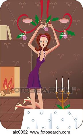 Drawing - An Aries woman hanging Christmas decorations on a ram horn-shaped chandelier. Fotosearch
