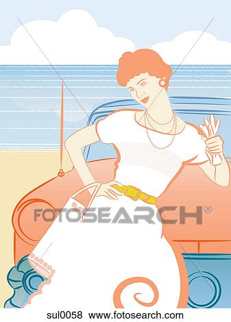 Stock Illustration - A woman holding driving gloves and posing in front of a car at the beach. Fotosearch