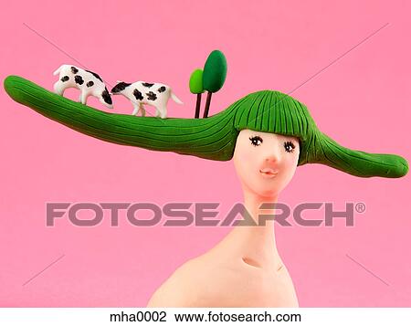 Drawing - A sculpture of a woman with a rural scene on her hair. Fotosearch