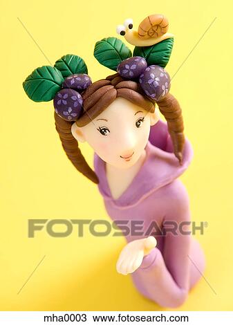 A sculpture of a woman with a snail in her hair View Large Illustration Drawing - A sculpture of a woman with a snail in her hair. Fotosearch