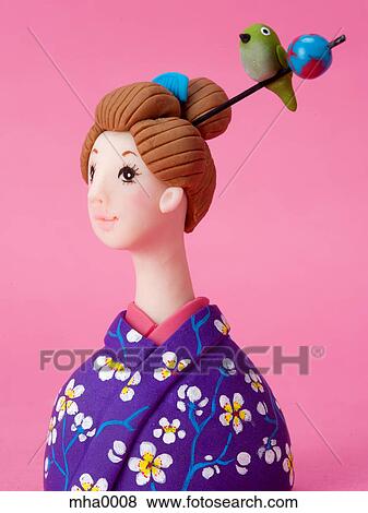 Stock Illustration - A sculpture of a young woman in Japanese costume. Fotosearch
