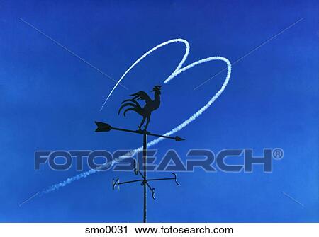 Clip Art - Weather vane against heart shaped vapour trail. Fotosearch
