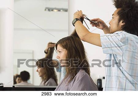 Young Male Hairdresser Cutting Woman S Hair In Salon Profile