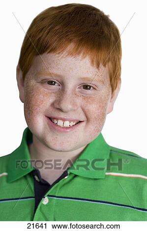 Boy With Freckles And Ginger Hair Smiling Close Up Front View