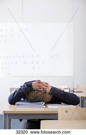 Male Student Sleeping At Desk In Classroom Stock Image 32320