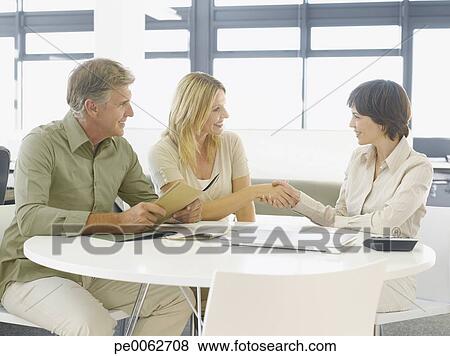 Picture - Couple greeting financial advisor. Fotosearch - Search Stock Photos, Images, Print Photographs, and Photo Clip Art