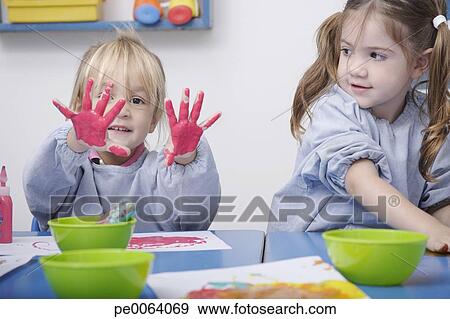 Girls Finger Painting In Classroom Girls Finger Painting In Classroom