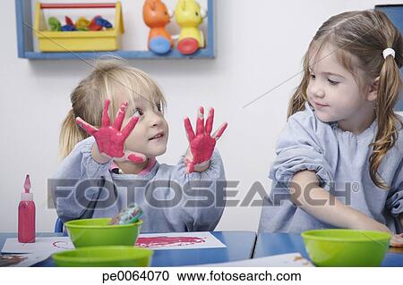 Girls Finger Painting In Classroom Girls Finger Painting In Classroom