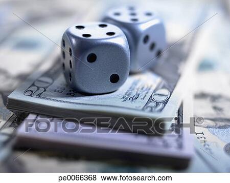 Close up of dice and US currency View Large Photo Image Picture - Close up of dice and US currency. Fotosearch - Search Stock Photos, Images, Print Photographs, and Photo Clip Art