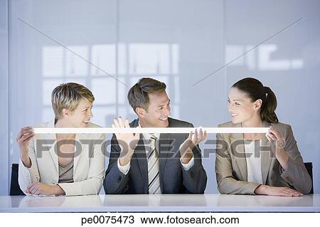 Business people looking at glowing light View Large Photo Image Stock Photo - Business people looking at glowing light. Fotosearch - Search Stock Images, Poster Photographs, Pictures, and Clip Art Photos