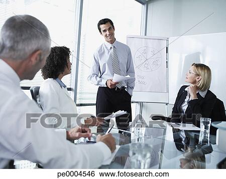 Group of office workers in a boardroom presentation View Large Photo Image Stock Image - Group of office workers in a boardroom presentation. Fotosearch - Search Stock Photography, Poster Photos, Pictures, and Photo Clip Art
