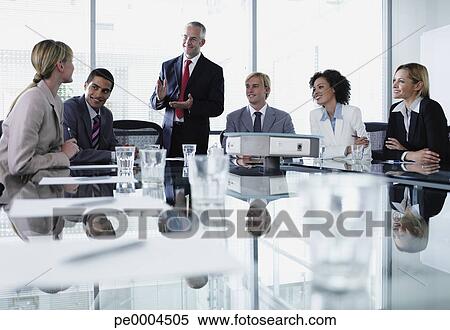 Group Of Office Workers In A Boardroom Meeting Stock