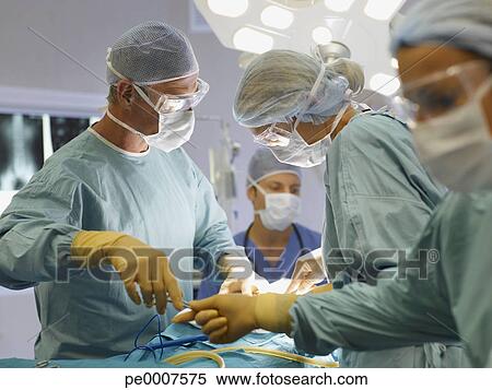 Stock Image - Team of nurses and surgeons in surgery. Fotosearch - Search Stock Photos, Mural Pictures, Photographs, and Photo Clipart