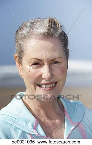 Stock Image - senior woman at the beach. Fotosearch - Search Stock Photography, Poster Photos, Pictures, and Photo Clip Art