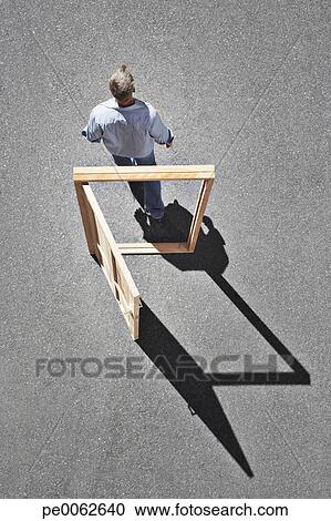 Man walking through door frame View Large Photo Image Stock Photography - Man walking through door frame. Fotosearch - Search Stock Photos, Pictures, Wall Murals, Images, and Photo Clipart