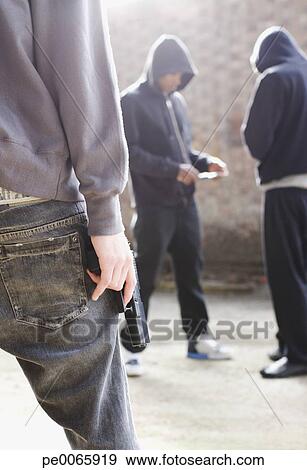 Stock Photograph of Man with gun approaching drug dealers pe0065919 ...