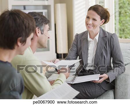 Couple meeting with financial advisor View Large Photo Image Stock Photography - Couple meeting with financial advisor. Fotosearch - Search Stock Photos, Pictures, Wall Murals, Images, and Photo Clipart