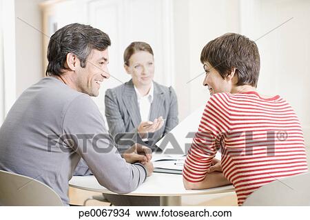 Stock Photo - Couple meeting with real estate agent. Fotosearch - Search Stock Images, Mural Photographs, Pictures, and Clipart Photos