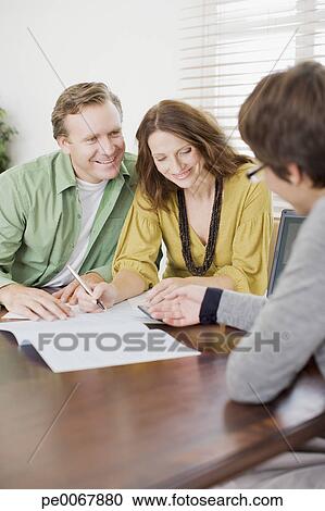 Stock Photography - Couple signing contract. Fotosearch - Search Stock Photos, Pictures, Wall Murals, Images, and Photo Clipart